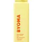 A yellow bottle of BYOMA Brightening Body Wash with product details in orange and black text.