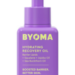 A purple bottle with a dropper cap labeled BYOMA Hydrating Recovery Oil, with details about the ingredients such as squalane, jojoba oil, and sea buckthorn oil.